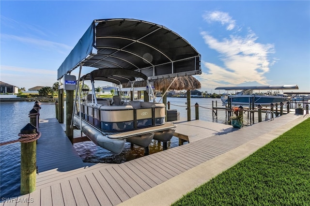 dock area with a water view and boat lift