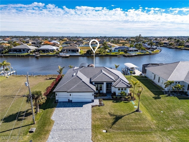 aerial view with a water view and a residential view