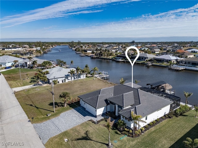 bird's eye view with a water view and a residential view