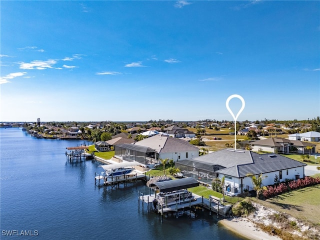 aerial view featuring a water view and a residential view