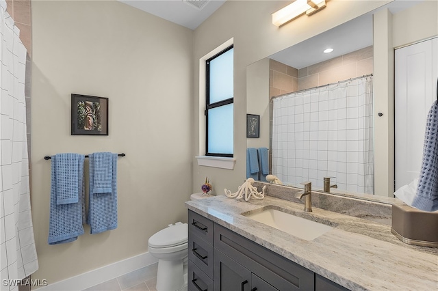 bathroom with a shower with shower curtain, toilet, vanity, tile patterned flooring, and baseboards