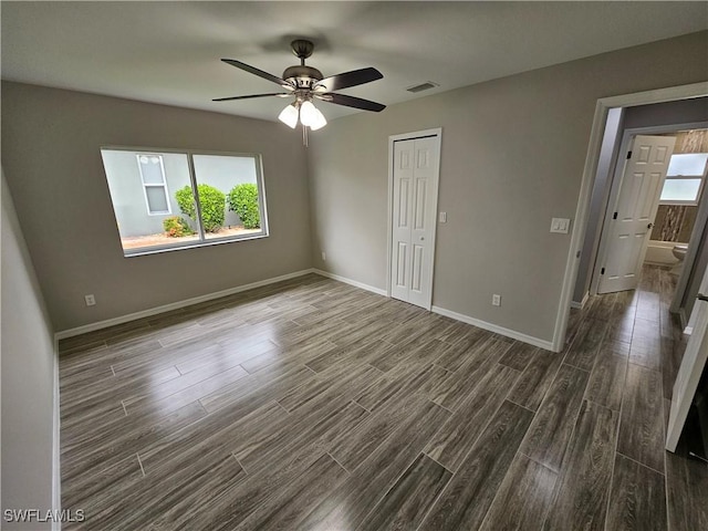 unfurnished room with a healthy amount of sunlight and ceiling fan