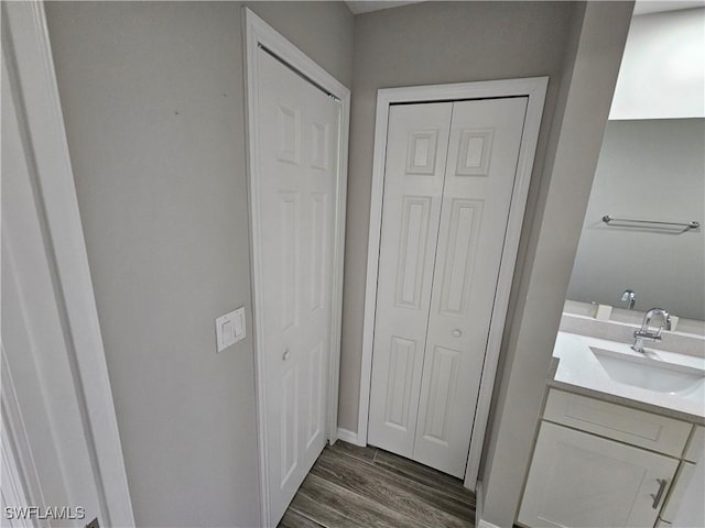 bathroom with vanity and hardwood / wood-style floors