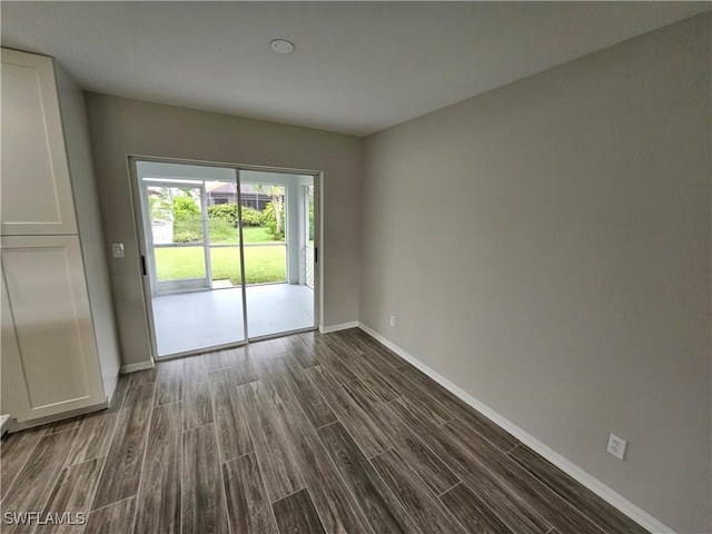 empty room featuring dark hardwood / wood-style floors