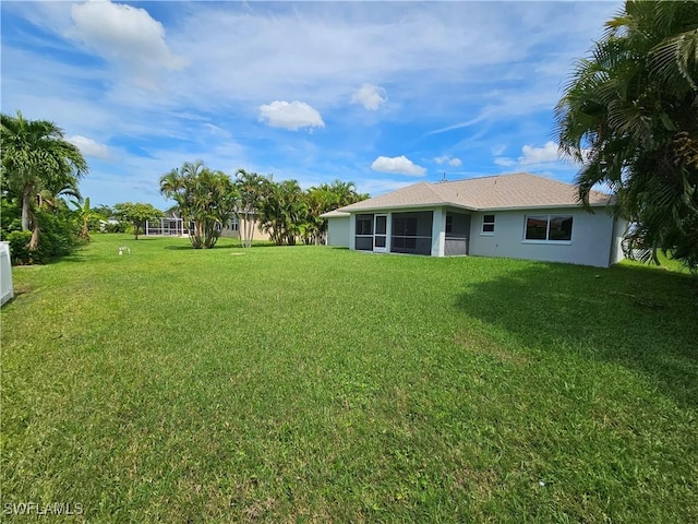 view of yard featuring a sunroom