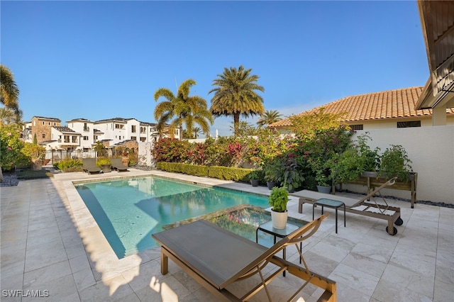 view of pool featuring a patio