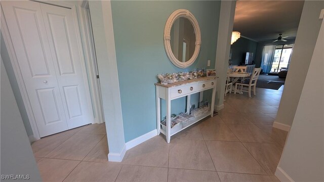 hallway featuring light tile patterned flooring