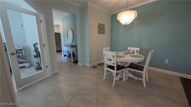 dining space featuring crown molding, light tile patterned floors, and a notable chandelier