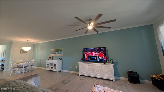 tiled living room featuring ornamental molding and ceiling fan with notable chandelier