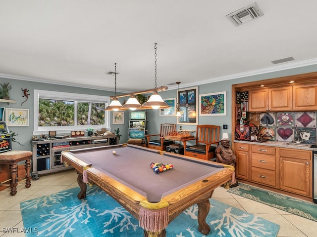 recreation room with crown molding, billiards, and light tile patterned floors