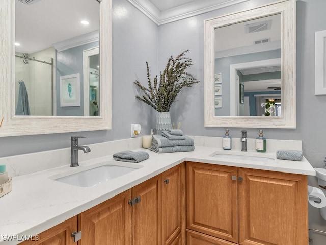 bathroom with vanity, crown molding, and walk in shower