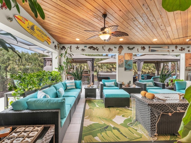 sunroom / solarium with wooden ceiling and ceiling fan