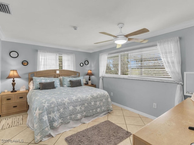 tiled bedroom with ceiling fan and ornamental molding