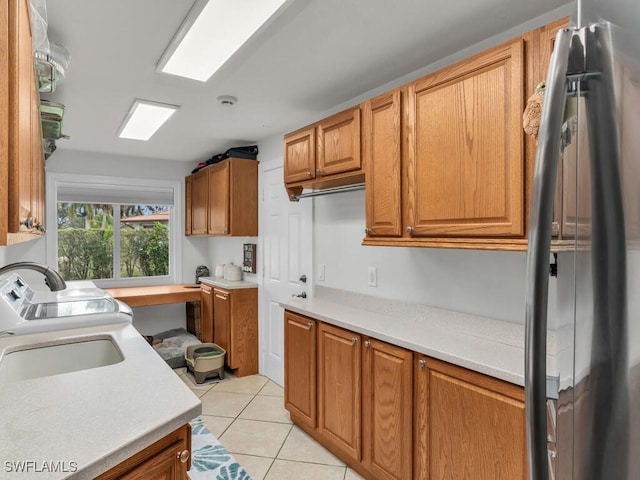 kitchen featuring stainless steel fridge and light tile patterned floors