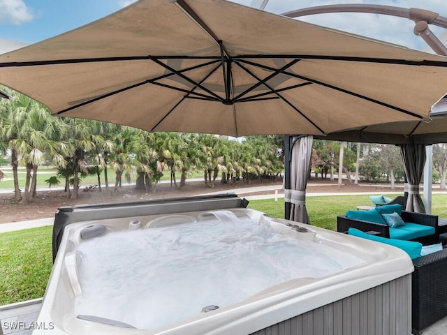 view of patio / terrace with an outdoor living space, a gazebo, and a hot tub