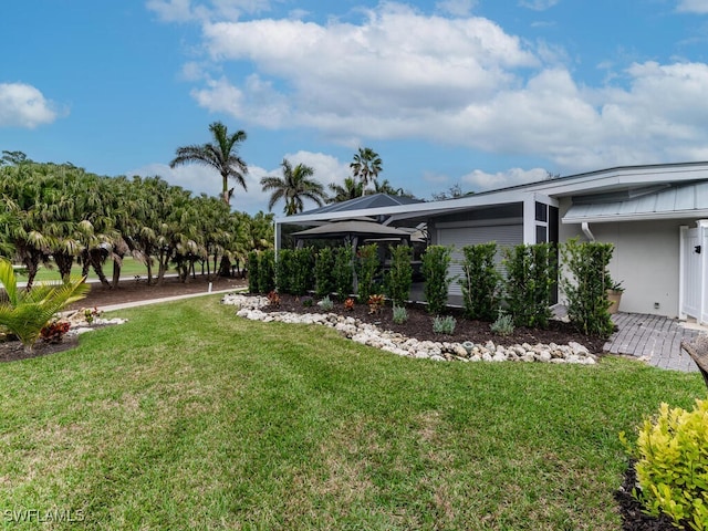 view of yard featuring a lanai