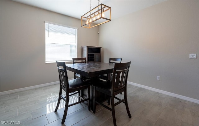 dining space featuring an inviting chandelier