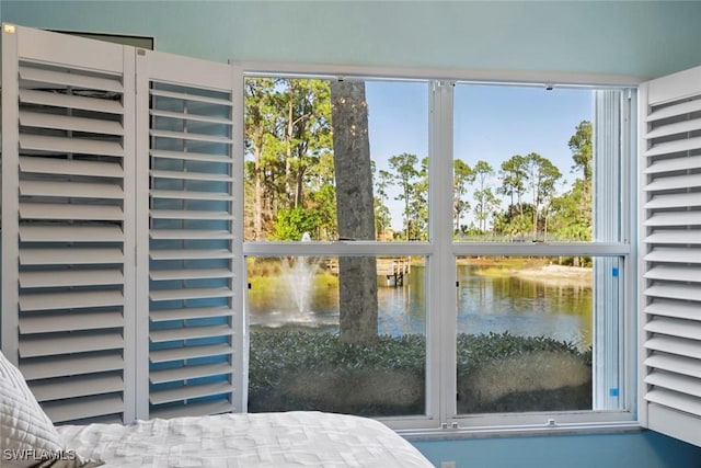 unfurnished bedroom featuring a water view