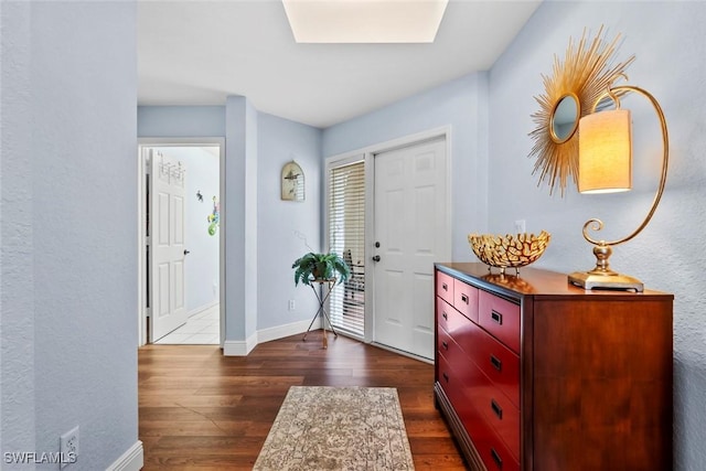 entryway with dark hardwood / wood-style floors