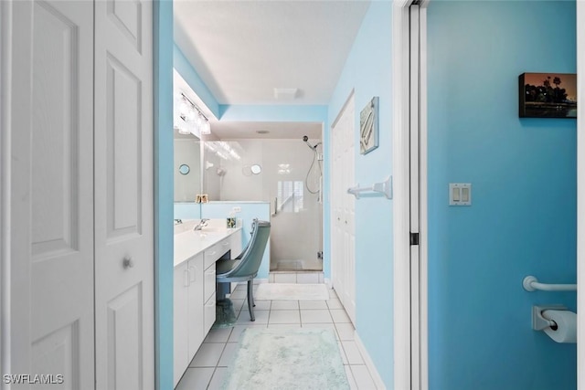 bathroom with vanity, tile patterned floors, and walk in shower