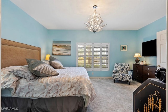 carpeted bedroom with an inviting chandelier