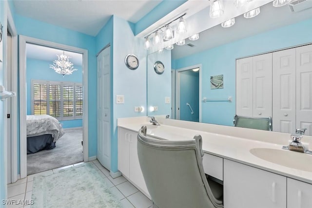 bathroom featuring tile patterned flooring and vanity