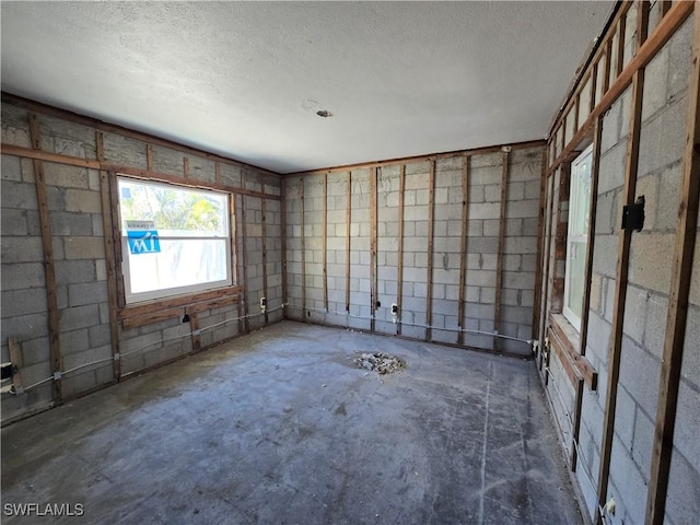 empty room with a textured ceiling