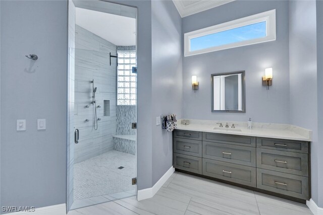 bathroom featuring vanity, crown molding, and a shower with door