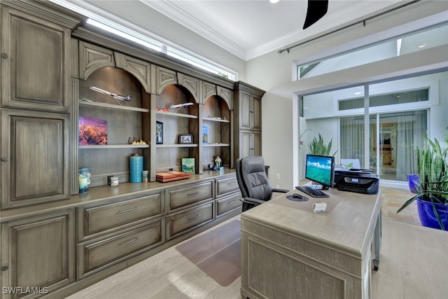 home office with ceiling fan, ornamental molding, and light wood-type flooring