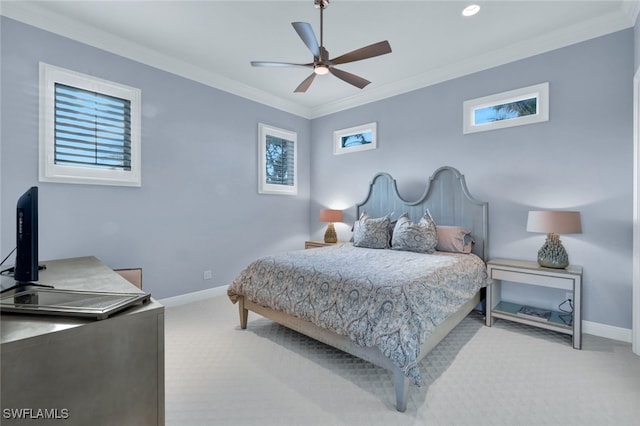 carpeted bedroom featuring crown molding, ceiling fan, and multiple windows