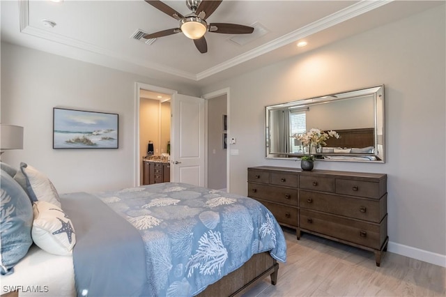 bedroom featuring ceiling fan, ensuite bath, and crown molding