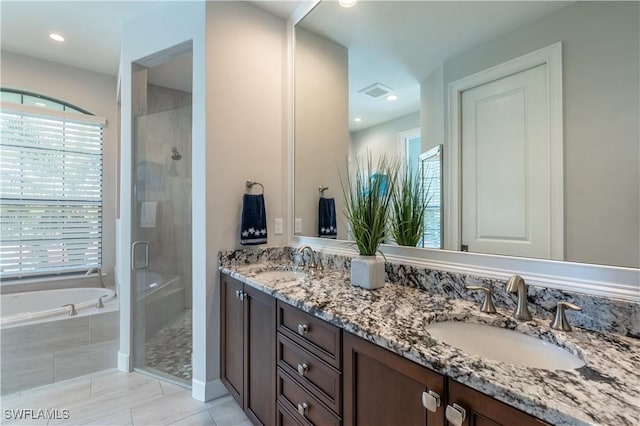 bathroom with vanity, tile patterned flooring, and independent shower and bath