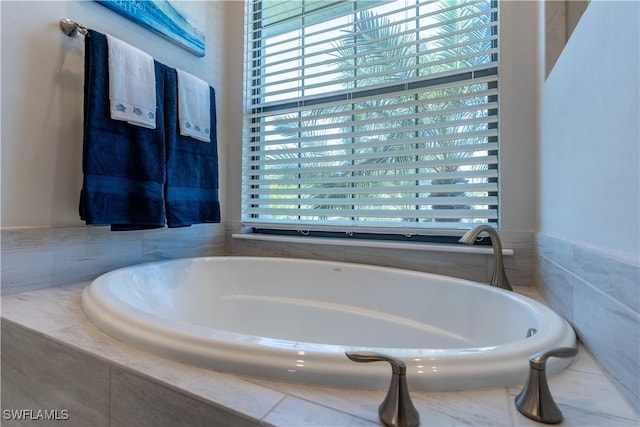 bathroom with tiled tub