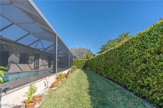 view of yard with a lanai