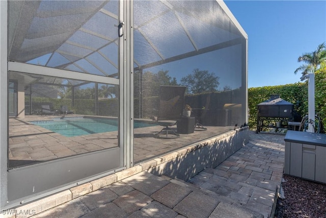 view of pool featuring a lanai and a patio area