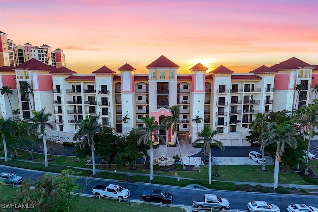 view of outdoor building at dusk