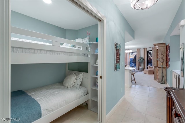 bedroom with light tile patterned floors