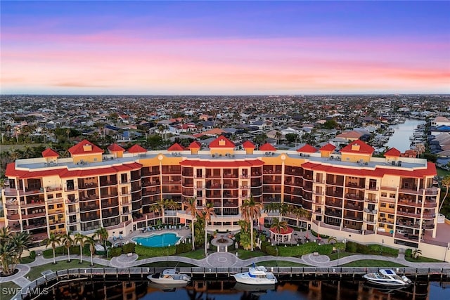 aerial view at dusk with a water view