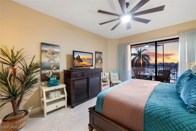 bedroom with ceiling fan, light colored carpet, and access to outside