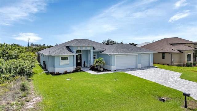 view of front of home featuring a garage and a front lawn