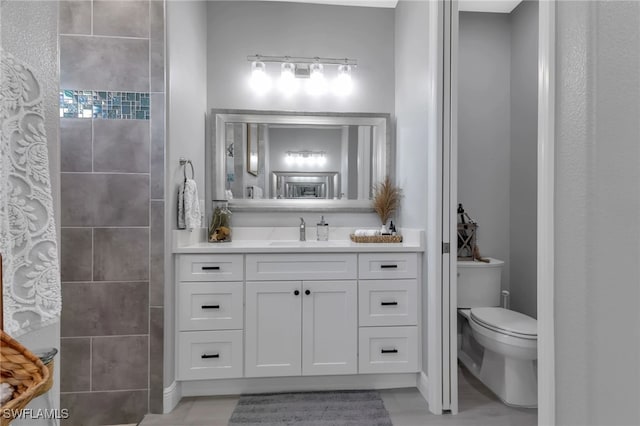 bathroom with vanity and toilet