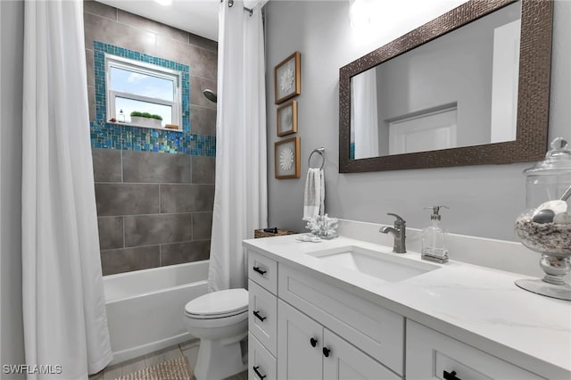 full bathroom featuring vanity, tile patterned floors, toilet, and shower / bath combo with shower curtain