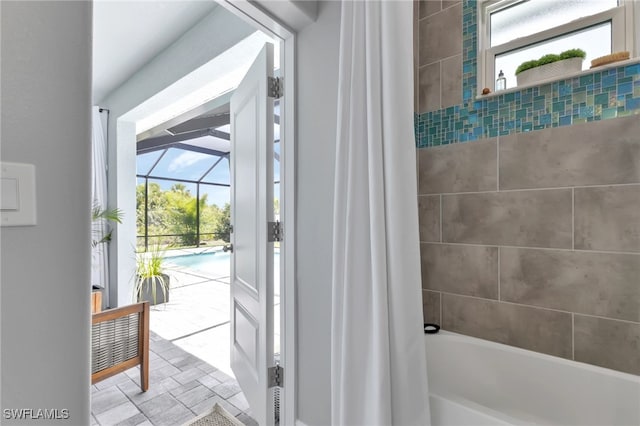 bathroom featuring shower / tub combo with curtain