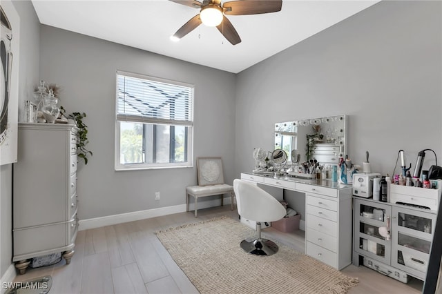 office space with light hardwood / wood-style floors and ceiling fan