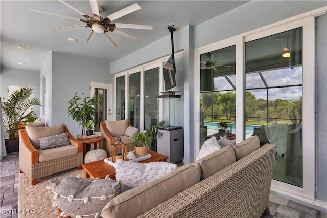 sunroom with ceiling fan