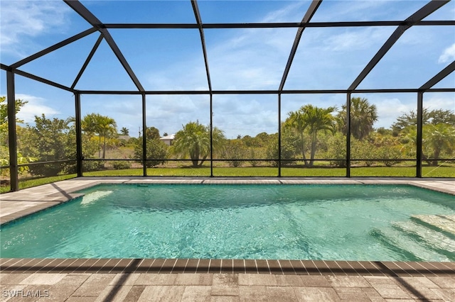 view of swimming pool with a lanai