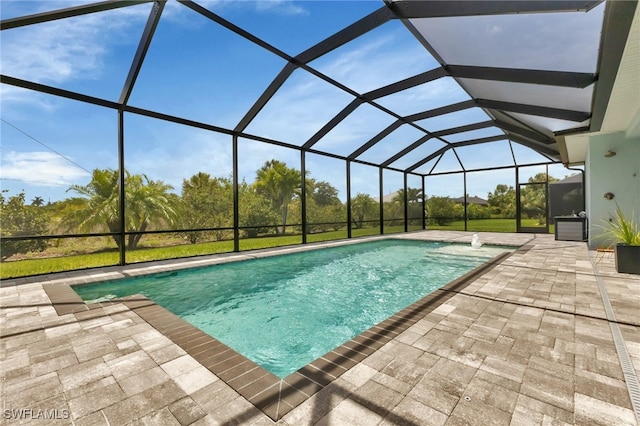 view of pool featuring a lanai and a patio area