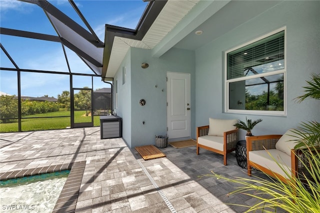 view of patio / terrace featuring glass enclosure