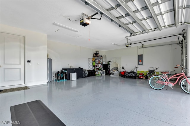 garage with a garage door opener and electric panel