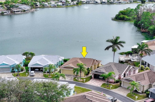 aerial view featuring a residential view and a water view